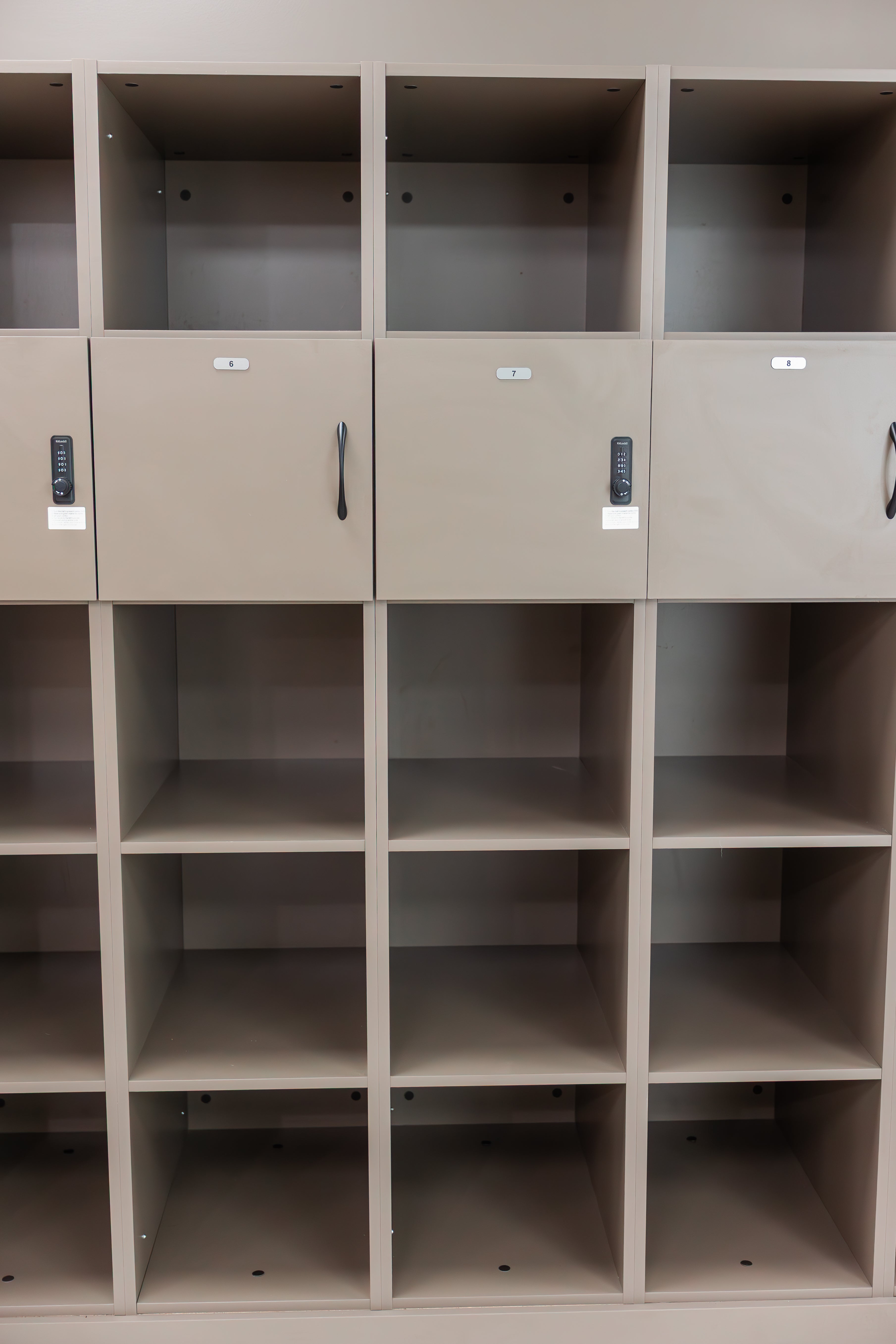 Lockers with keypad locks and open cubbies at Prana Fredericton